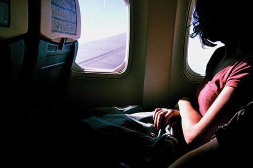 woman airplane travel insurance