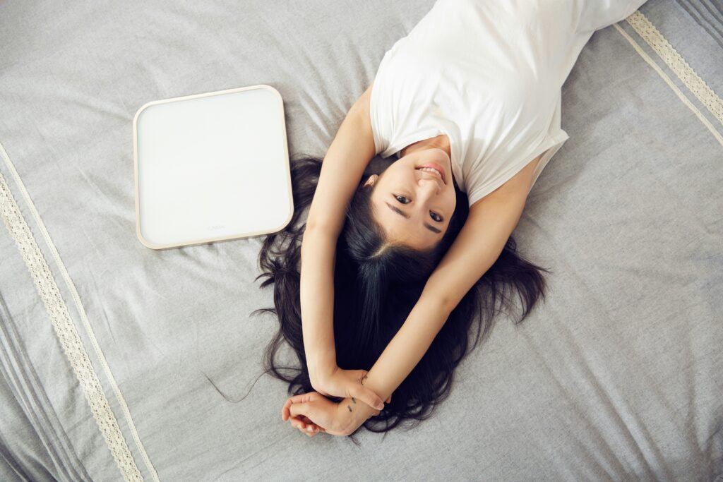 asian woman lying on bed